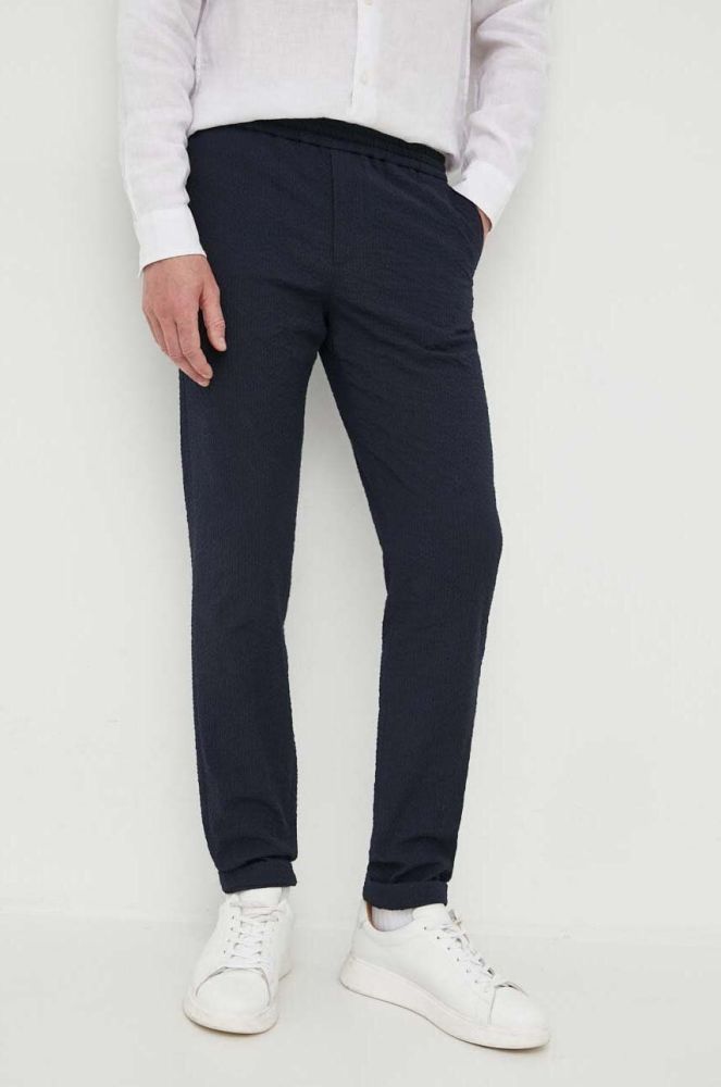 Штани Tommy Hilfiger чоловічі колір синій облягаюче (3238591)